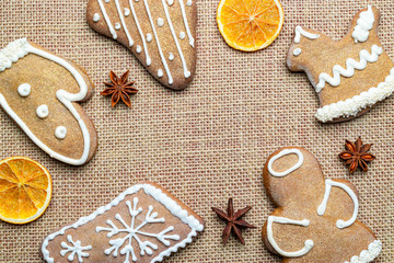 Obraz na płótnie Canvas Christmas background. Handmade festive gingerbread cookies. Copy space for text. Winter holidays background mock up
