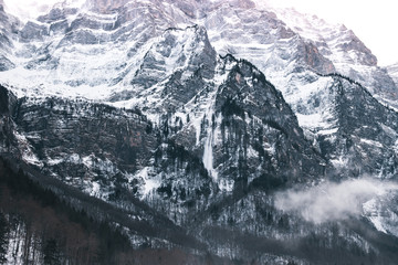 Fototapeta premium Snow Mountains Cover In Fog, Switzerland.