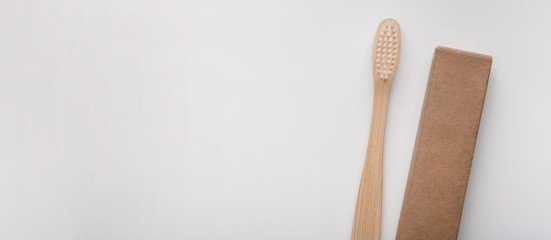 Holder with eco bamboo toothbrush on white background