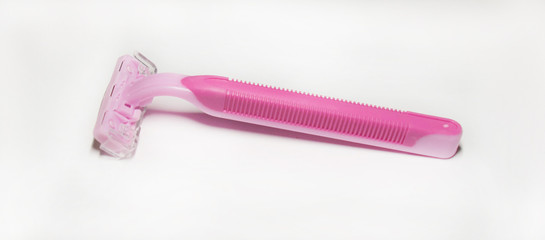  Disposable razor. Pink razor on a white background.