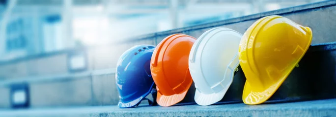 Foto op Plexiglas Multicolored Safety Construction Worker Hats. Teamwork of the construction team must have quality. Whether it is engineering, construction workers. Have a helmet to wear at work. For safety at work. © Rapeepat