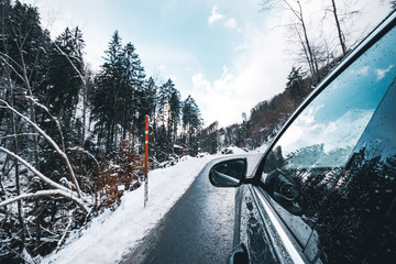 A Car On The Road In Winter, Switzerland.