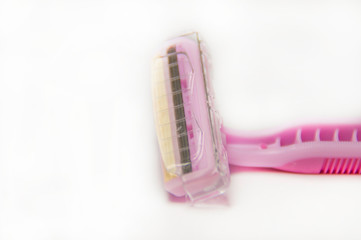  Disposable razor. Pink razor on a white background.