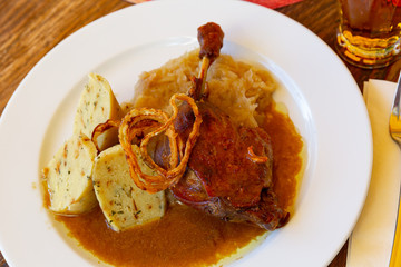 Confit duck leg with sauerkraut and dumplings