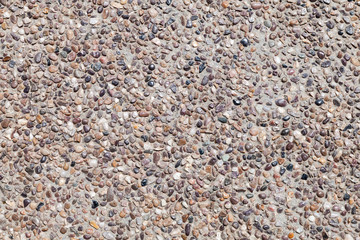 Vintage stone pavement with round pebble pattern in concrete