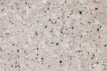 Vintage stone flooring with pebble pattern in concrete