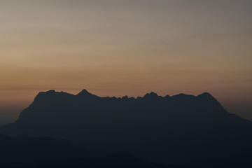 morning and sunrise on the winter season over the mountain layer at chingmai , thailand.