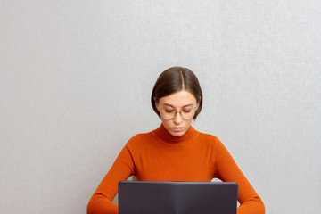 Young women programmer developer software engineering on laptop while sitting in office interior.