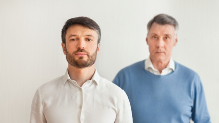 Mature Man And Senior Father Standing Over White Background, Panorama
