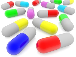 Colored medical capsules on white