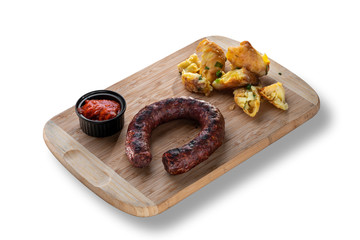 Delicious sausage with red sauce and potatoes