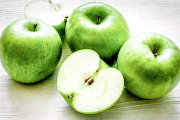 Healthy green food with apples on kitchen white background