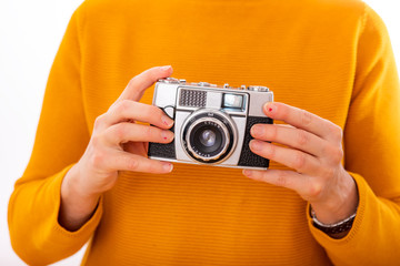 Woman holds nostalgia camera in her hands