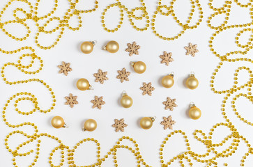 Christmas pattern with golden balls, snowflakes and garland on white background.