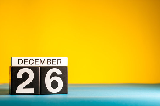December 26th. Image 26 day of december month, calendar on yellow background with empty space for text