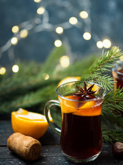 Two glasses of traditional Christmas and winter hot drink mulled wine of red wine with cinnamon, anise, berries and orange