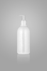 cosmetic container with pump on light background. bottle with gel