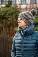 Woman with down jacket and wool hat