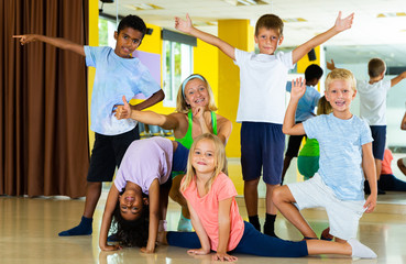 Happy children in dance studio smiling and having fun