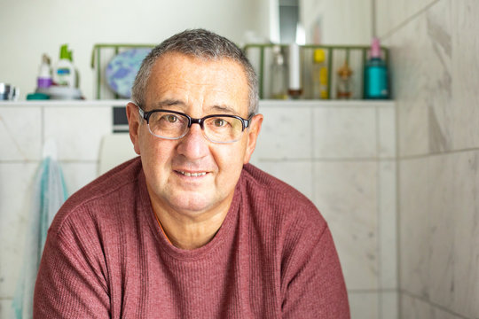 Man with glasses and sweater