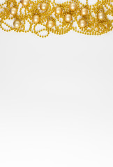 Christmas border with gold garland on white background. Happy new year. Space for text. Winter concept. Greeting card.