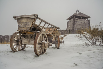 Fototapeta na wymiar Cart under the snow in the old Ukrainian village