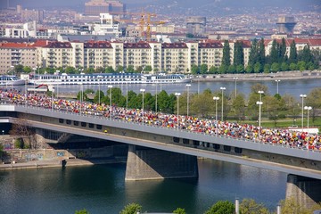 Vienna Marathon runners on a bridge