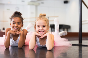 Two little girls rehearsing in dance school - obrazy, fototapety, plakaty