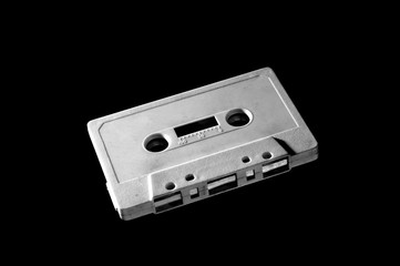 Obraz premium old white audio cassette on dark background