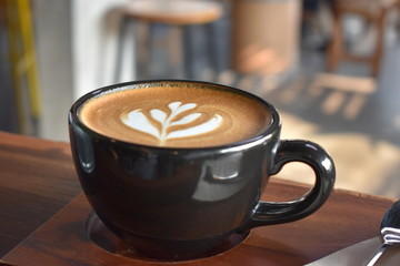 cup of coffee on wooden table