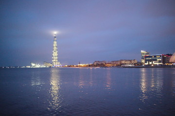 Obraz premium Gulf of Finland coast on a winter evening city with lights