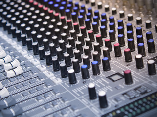 Sound equalizer mixing. Professional studio equipment for sound mixing. Music studio image. Close up and selective focus.