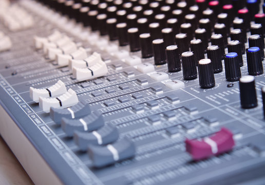 Sound equalizer mixing. Professional studio equipment for sound mixing. Music studio image. Close up and selective focus.