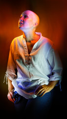 Artistic portrait of a lady in a white shirt created by colored light