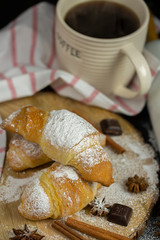 Morning croissant with coffee mug