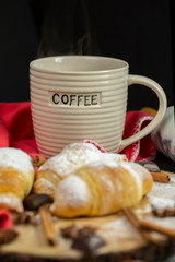 Morning croissant with coffee mug