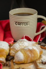 Morning croissant with coffee mug