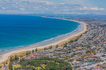 Fototapeta premium View on Touranga city and Papamoa Beach from Mount Maunganui on northern island of New Zealand in summer