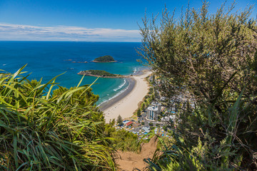 View on Touranga city and Papamoa Beach from Mount Maunganui on northern island of New Zealand in summer