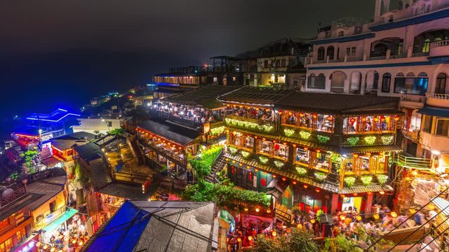 Time lapse of Jiufen in the evening with many tourists.
