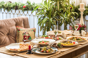 Served table with dishes. side view. light background