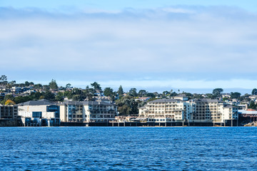 Fototapeta premium Condos on Monterey Coast Past Blue Sea