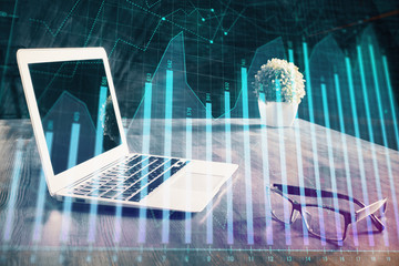 Double exposure of forex chart and work space with computer. Concept of international online trading.