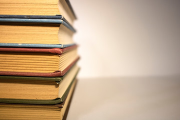 stack of books on white background close up