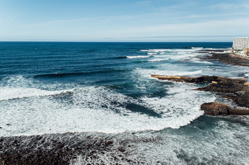 Fototapeta na wymiar Waves on the rocky coast of Tenerife island, Canary islands, Atlantic ocean, Spain