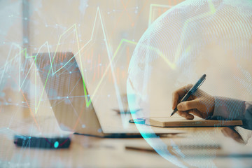 Double exposure of forex chart with man working on computer on background. Concept of market analysis.