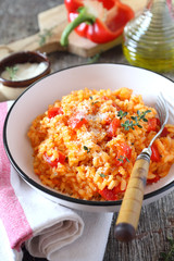 Italian cuisine. Plate of red bell pepper risotto