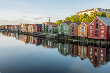 Fototapeta premium Colorful wooden buildings near Nidelva river in the city of Bakklandet/Trondheim in Norway. Architecture, buildings, travel and photography concept.