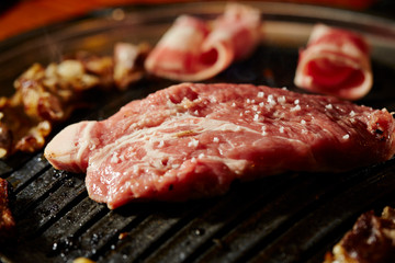 Korean BBQ, meat on iron plate 