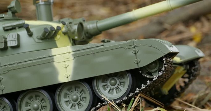 caterpillars of a battle tank in a combat position, camera in motion
